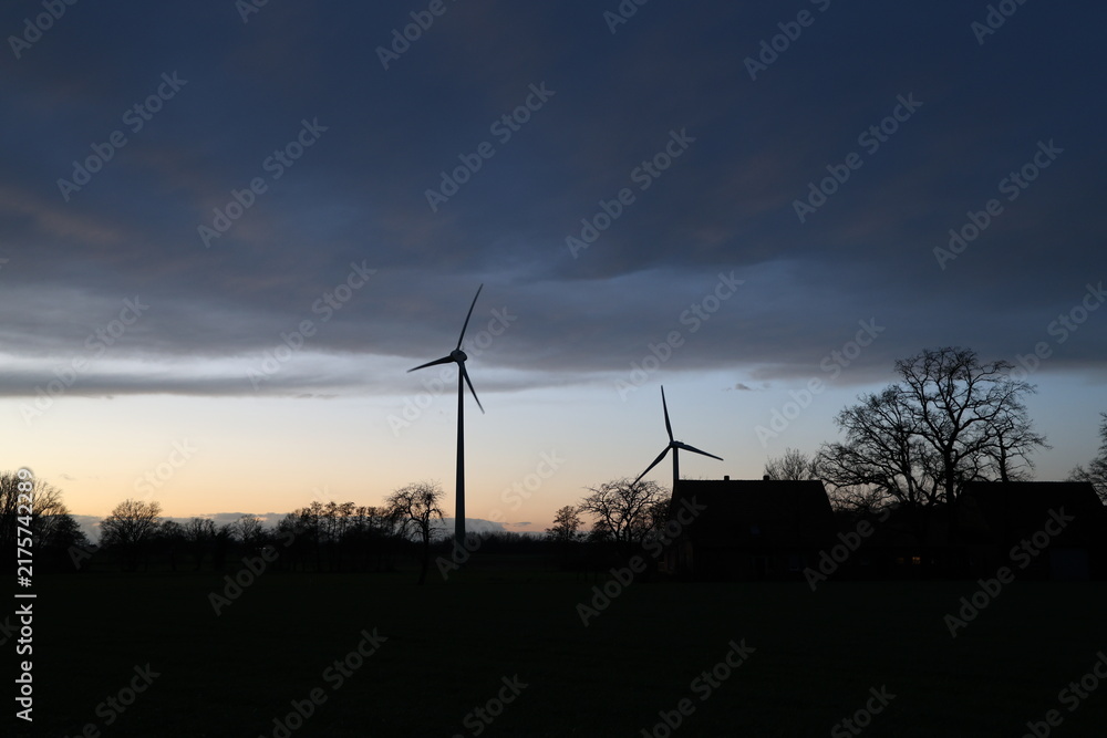 Obraz premium wind turbine at sunset