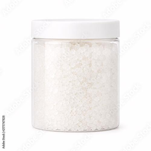 White granular citric acid in glass jar