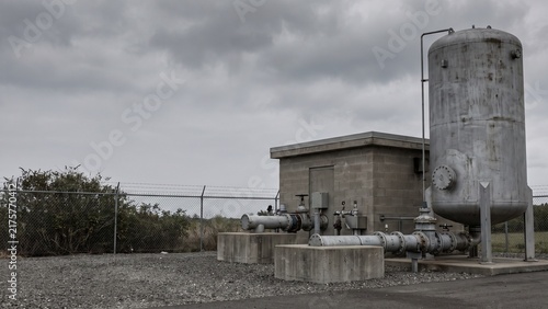 Фотография Water surge protection vessel beside a pumping station