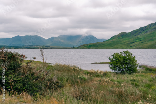 Картината върху платно Twelve Bens mountain range, a rugged chain of peaks rising above the scenic Connemara landscape in western Ireland - County Galway, Ireland - 31 August 2026