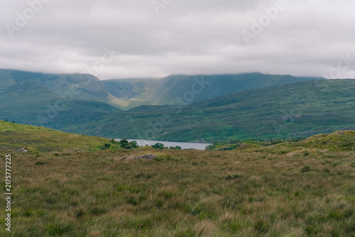 Картината върху платно Twelve Bens mountain range, a rugged chain of peaks rising above the scenic Connemara landscape in western Ireland - County Galway, Ireland - 31 August 2026