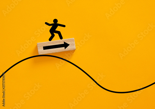 Quadro su tela Person icon surfing a wave finding direction to success