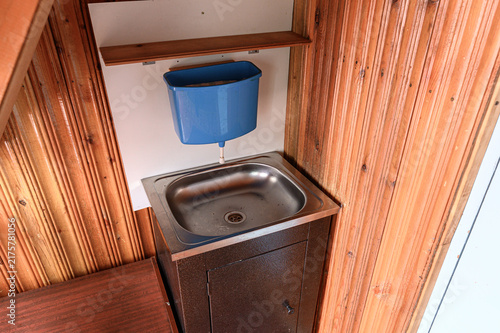 Принти на полотні compact outdoor washstand features stainless‑steel sink atop dark cabinet