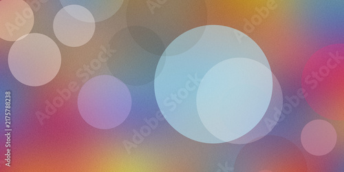 Dreamy bokeh background with pastel colored glowing circles overlapping soft textured gradient of gold blue and pink.