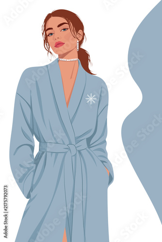 Elegant Woman in Blue Winter Coat with Snowflake Brooch, Fashion Portrait. Beautiful Female in Stylish Warm Outfit with Jewelry Chains for Christmas, New Year Beauty, and Luxury Style