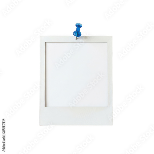 Blank polaroid photo frame attached to the wall with a blue push pin