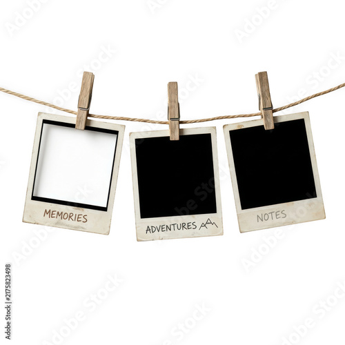 Bild auf Leinwand Three blank instant photo frames hanging on a rope with wooden clips