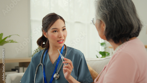 Obraz na płótnie Elderly caregiver nursing home care consultation with nurse and senior woman in