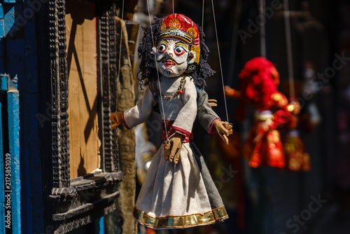 Nepal. Central. Kathmandu. Kathmandu Valley. A string puppet depicting a deity or a character from Nepalese folklore, in a souvenir shop