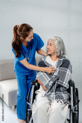 Professional nurse providing compassionate care senior patient i