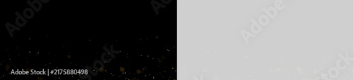 Tiny glowing particles scatter across a dark background creating a starry effect. The spots vary in warm golden hues with subtle transparency and soft focus.