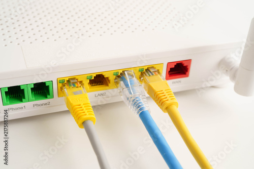 Obraz na płótnie Ethernet cable with wireless router connect to internet service provider network.