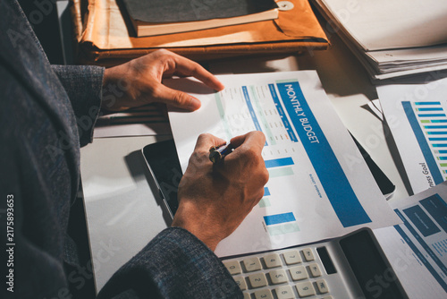 Принти на полотні Professional photo of a person's hands reviewing a contract or legal document on