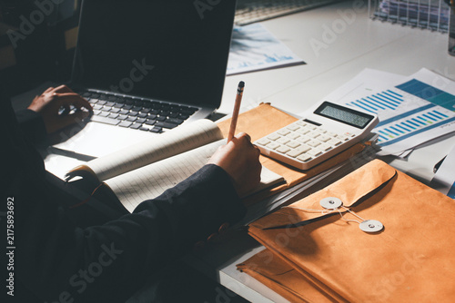 Принти на полотні Professional photo of a person's hands reviewing a contract or legal document on