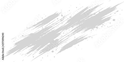 Gray paint brush strokes and splatters on a white background with copy space for design elements