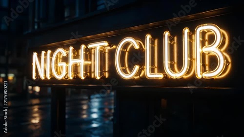 Close-up of a glowing neon sign NIGHT CLUB on a city building at night. Nightlife entertainment and luxury party lifestyle concept