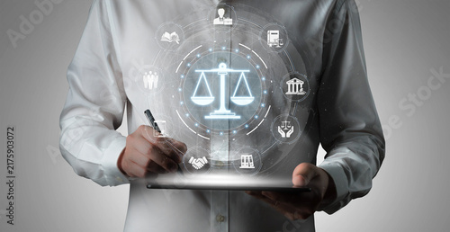 Obraz na plátně Business professional showcasing digital legal symbols and icons on tablet with