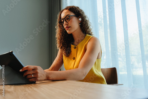 Using a tablet for digital work indoors at a table