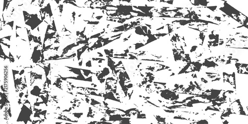 Abstract distressed texture with sharp geometric fragments in monochrome tones for graphic design backgrounds