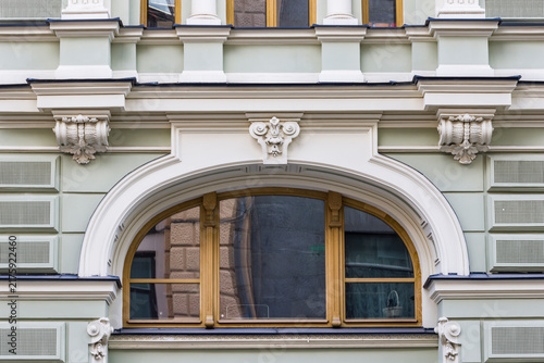 facade of an old building with big arch window