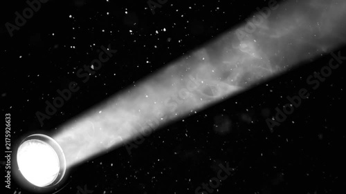 Spotlight shining through smoke and falling snow, creating a dramatic cinematic background. Perfect for winter, Christmas, New Year, stage, concert and festive visual effects.