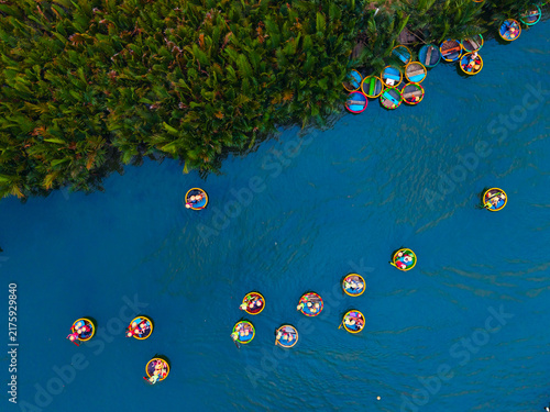 Colorful travel view basket boats on thu bon river, hoi an, vietnam, scenic tropical landscape