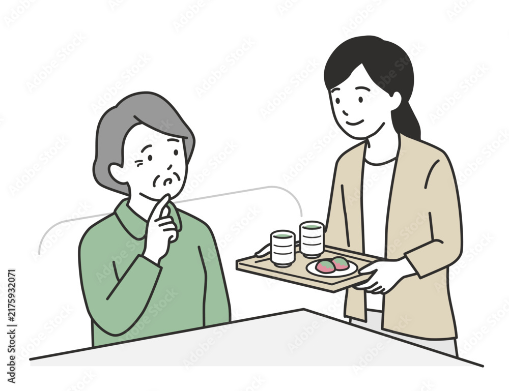 Obraz premium 高齢の母親にお茶とお菓子を運んでお茶の時間にする優しい娘