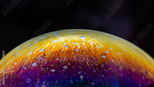 Soap bubble reflecting colorful abstract patterns