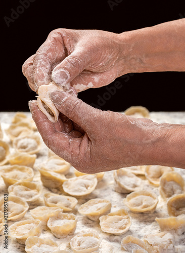 Foto Hands, ravioli, meat filling