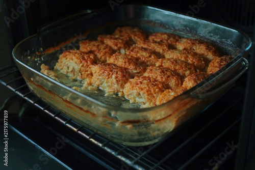 Homemade meat patties baking in the oven