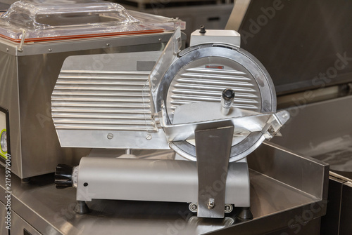Картината върху платно Stainless Steel Electric Meat Slicer Commercial Machine in Professional Kitchen