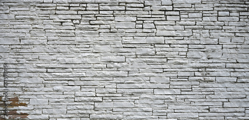 Картината върху платно Weathered white painted machine-cut stone masonry surface in a horizontal compos