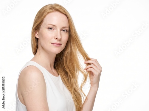 Beautiful Young Woman with clean, fresh skin. Facial treatment. Cosmetology, beauty, and spa. A nice and attractive girl with a pleasant smile.	