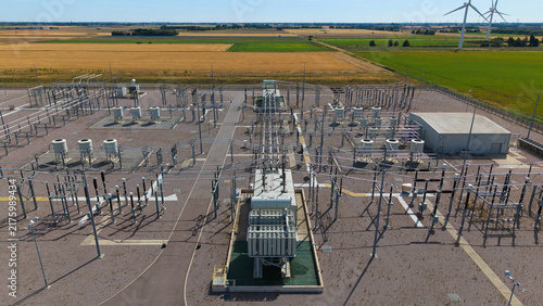 Aerial view of Triton Knoll offshore windfarm 400220kV substation featuring electrical transformers and switchgear equipment surrounded by agricultural fields in Boston, England, United Kingdom.