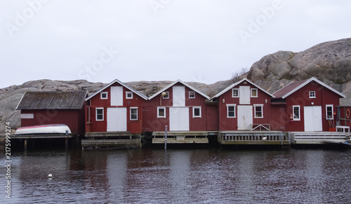 Traditional Red Wooden Fishing Huts along Waterfront in Smogen Sweden
