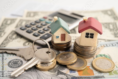 Obraz na płótnie House on stack coins, mortgage home loan insurance finance.