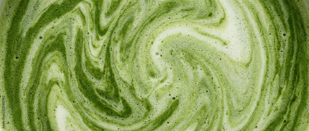Obraz premium Matcha Latte Milk Texture Background, Creamy Green Tea Liquid with Natural Swirls