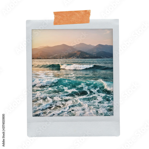 Instant frame featuring a scenic ocean view with rolling waves and distant mountains at sunset isolated on a transparent background