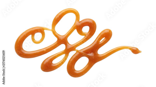 Konstfotografi Swirl of sweet liquid caramel sauce drizzled in a decorative pattern for dessert