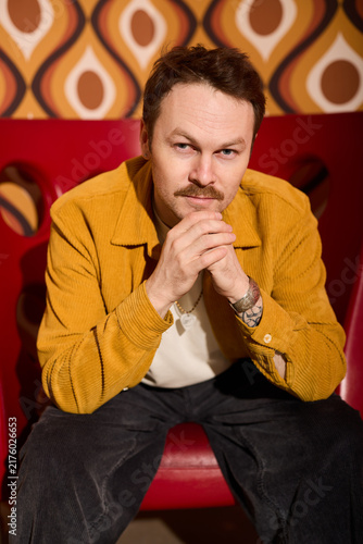 Принти на полотні Casual portrait of confident man wearing mustard jacket