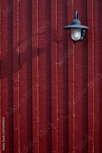 Vintage Lamp on Red Wooden Wall with Copy Space
