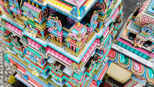 Aerial view of the colorful Hindu temple featuring intricate architectural details and vibrant sculptures in Grand Gaube, Riviere du Rempart, Mauritius.