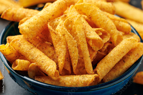 Rolled Tortilla Corn Chips in Blue Bowl on dark background