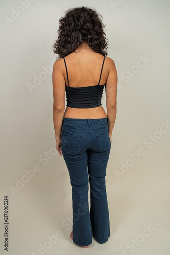 Fotografie Woman wearing crop camisole and flare pants