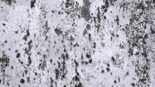 Принти на полотні Rough monochrome concrete wall texture with irregular dark stains, peeling areas and natural surface imperfections, ideal for grunge backgrounds, textures and industrial designs