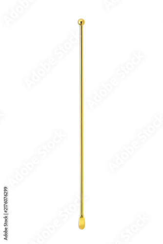 Obraz na płótnie Elegant golden metal cocktail stirrer with a spherical top and a small spoon at