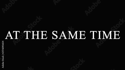 Text AT THE SAME TIME repeating across screen in cinematic motion with subtle color shifts
