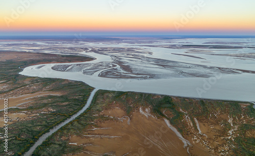 Amazing early morning aerial view on tidal mud flats taken from a helicopter around the Derby area, Kimberley region, Western Australia