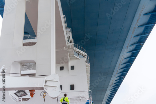 Canvastavla Dramatic close-up view from the lower deck of a commercial vessel passing directly beneath the Zhangjinggao Yangtze River Bridge