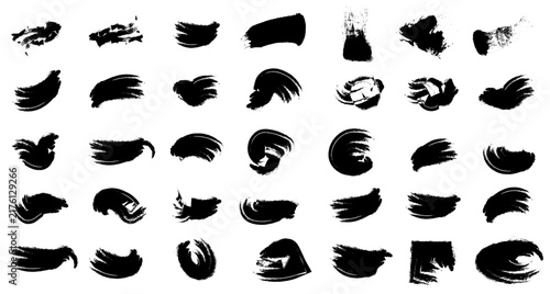 Set of black ink brush strokes isolated on white background